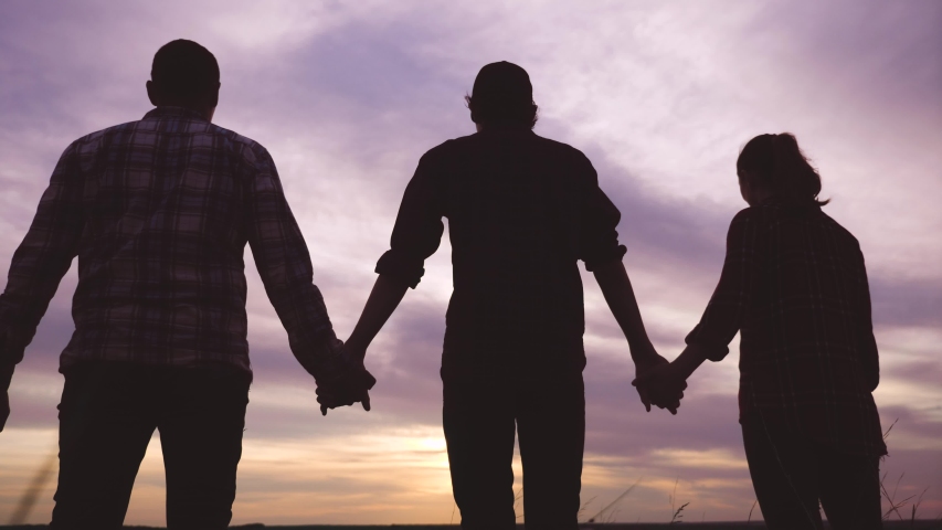 teamwork. team community hold hands together silhouette at sunset unity. group of people hands. teamwork workers carry out one mission go to the goal . business team in the company working partnership Royalty-Free Stock Footage #1054277399