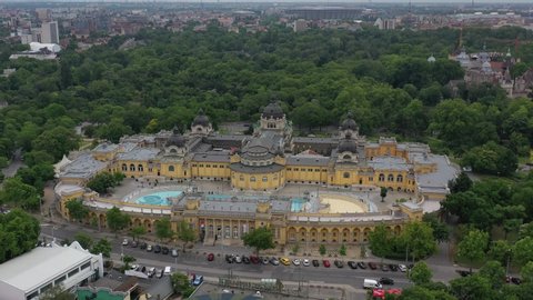 The Szechenyi Thermal Bath  in the Budapest city park. In the background are Vajdahunyad Castle and Heroes' Square. BUDAPEST, HUNGARY - JUN 11. 2020.