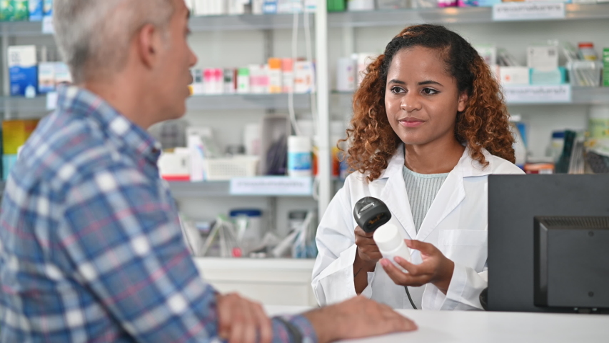African american woman pharmacist consulting customer in drug store Royalty-Free Stock Footage #1054285787