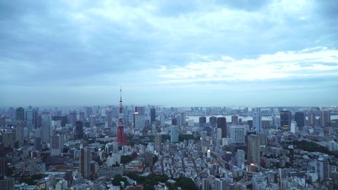 Tokyo, Japan 4K timelapse, fast motion of Tokyo city, Roppongi Hill,  Observatory deck in fast motion, timelapse from early evening to night and Tokyo Tower light up, illumination time.