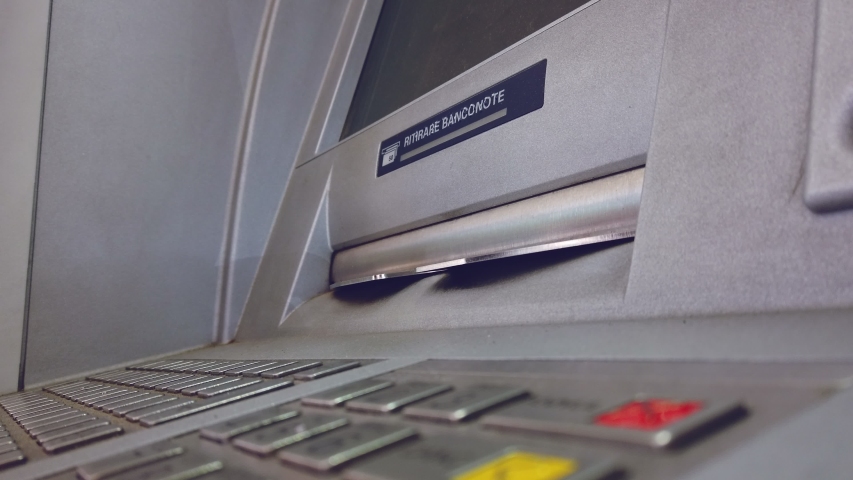 ATM machine hand taking cash bank withdrawal service with the italian text "ritirare banconote" meaning take cash Royalty-Free Stock Footage #1054295366
