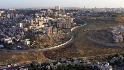 Security Wall divide Israel and Palestine. Panorama Aerial view
Drone View over Anata Refugee Camp And Jewish Pisgat Zeev neighborhood.
