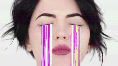 Glitch art. Pixel tears. Portrait of upset woman crying with real pink noise from closed eyes.