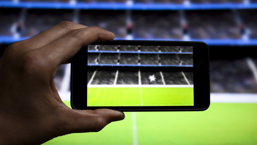 Man shooting video and streaming soccer match at stadium | Shutterstock HD Video #1054309094