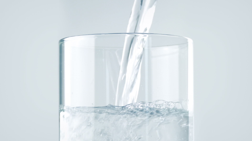 Pure Water Poured Into Glass Closeup | Shutterstock HD Video #1054312490