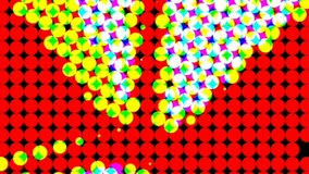 Computerized animation of small white and yellow circles revolving on red background. Motion graphics. VJ loops.Disco theme.