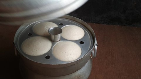 Idli or idly steamed cooking popular breakfast of South India and Sri Lanka. Healthy steamed rice cakes are made by steaming batter consisting of fermented rice tamil nadu Kerala India