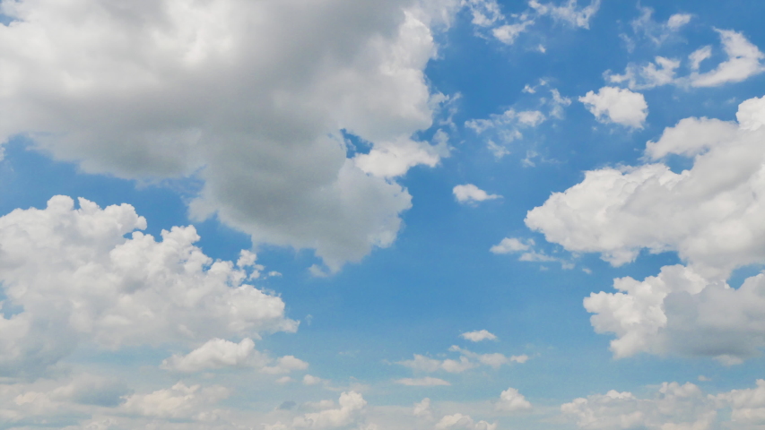 Timelapse of Clouds and Blue Sky. Puffy fluffy white clouds. Cumulus cloud scape timelapse. Summer blue sky time lapse