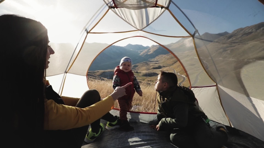 People inside the tent. on a mountainside in Montenegro mooving camera