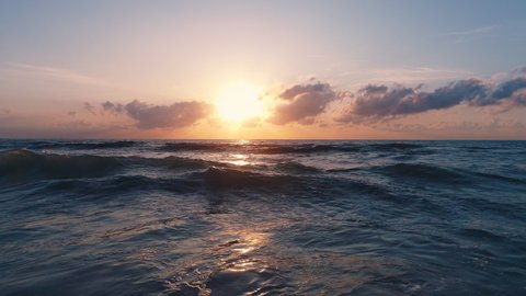 Sea sunrise, ripple ocean waves