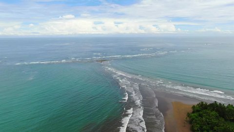 Beautiful cinematic aerial footage of the Whale Tale beach in the Marino Ballena National Park in Costa Rica 