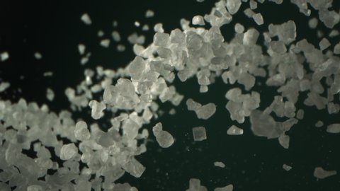 Salt is Flying in the Air in High Speed on Green Aqua Menthe Color Background Shot at 1000 fps 4K