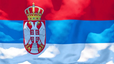 The national flag of Serbia flutters in the wind