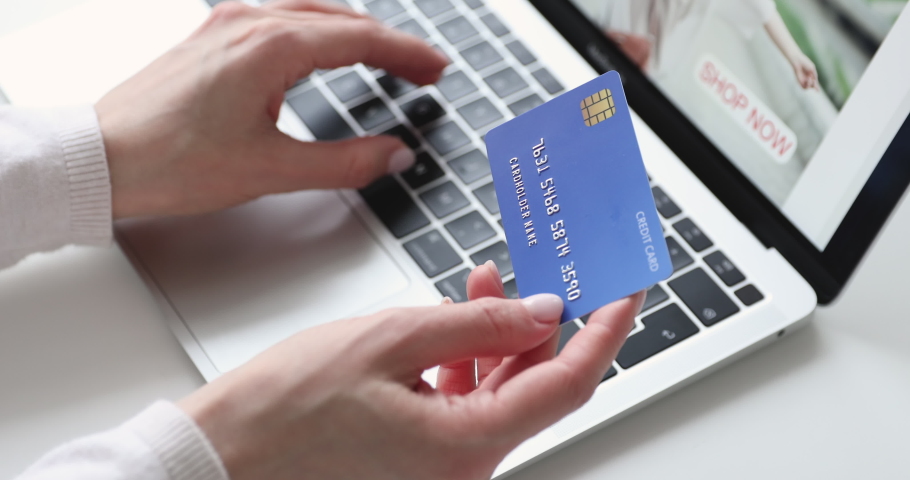 Close up young woman entering banking credit card information, purchasing goods or services online. Female shopper making payments in internet store on computer application, ecommerce concept. Royalty-Free Stock Footage #1054349744