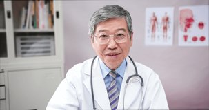 Telemedicine concept - asian male senior doctor talking symptom to patient on the internet and make a discussion with ok gesture