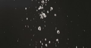 Ripe cherries fly up and fall down with droplets of water. Running water falls from a height. Water splashes and berries scatter in different directions on a black background. Full HD, 240fps,1080p