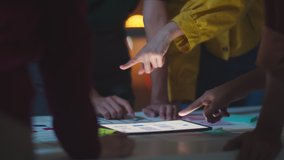 Group of Asia young creative people in smart casual wear discussing business brainstorming meeting ideas mobile application software design project in modern night office. Coworker teamwork concept. - Powered by Shutterstock - Get 15% off with code: PIKWIZARD15