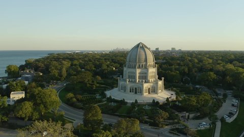 Drone Flies Past Bahai House of Worship with Chicago Skyline in Distance during Summer
