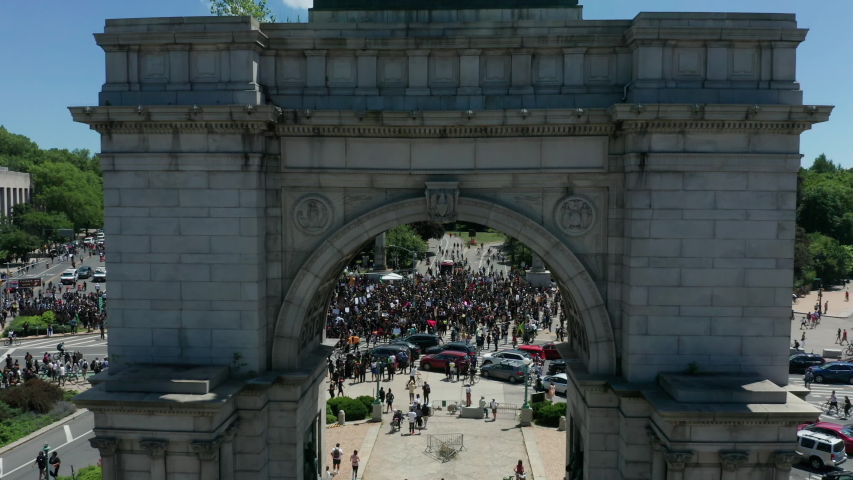 rising over arch reveal of huge BLM protest in Grand Army Plaza Brooklyn