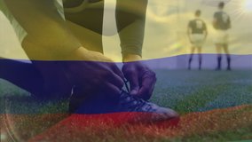 Animation of Colombian flag waving over mixed race male rugby player tying a shoe digital composition - Powered by Shutterstock - Get 15% off with code: PIKWIZARD15