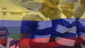 Animation of a Colombian flag waving over multi-ethnic male rugby team standing in a row digital composition - Powered by Shutterstock - Get 15% off with code: PIKWIZARD15