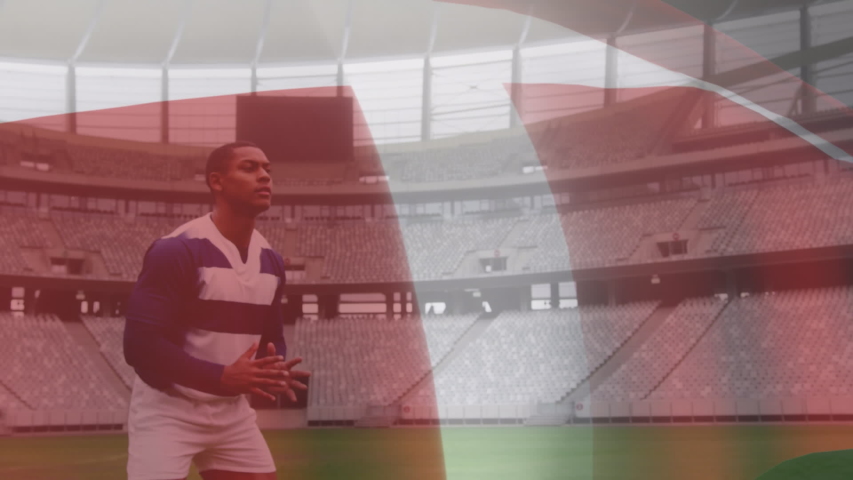Animation of Danish flag waving over mixed race male rugby player catching a ball digital composition