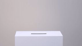 People putting paper in ballot box