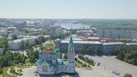 Dolly zoom. The Cathedral of the Assumption of the Blessed Virgin Mary, panoramic views of the city. Omsk, Russia, Aerial View
