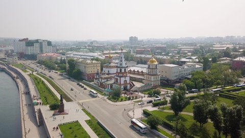 Russia, Irkutsk. Cathedral of the Epiphany. Embankment of the Angara River, Monument to the Founders of Irkutsk. The text on the Russian - Irkutsk, Aerial View Hyperlapse, Point of interest