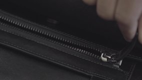 Close the zipper of the black bag - Powered by Shutterstock - Get 15% off with code: PIKWIZARD15