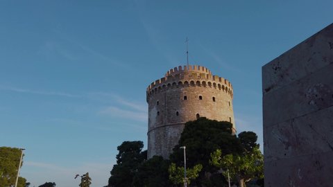 4K reveal clip of the White Tower monument in Thessaloniki, Greece, On a clear morning