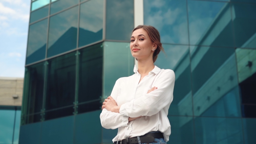 Businesswoman successful woman business person standing outdoor corporate building exterior Pensive elegance caucasian confidence professional business woman middle age female leader