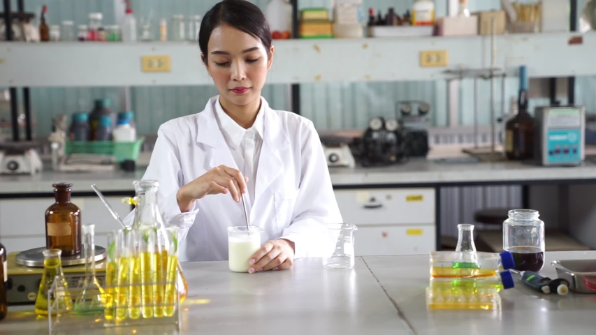 The scientist,dermatologist testing the organic natural cosmetic product in the laboratory.research and development beauty skincare concept.blank package,bottle,container .cream,serum.hand | Shutterstock HD Video #1054420472