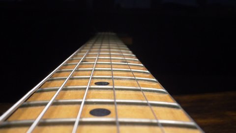 super close up. fretboard and electric guitar strings.
