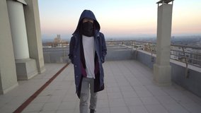 Lonely man on a walking on a rooftop. - Powered by Shutterstock - Get 15% off with code: PIKWIZARD15