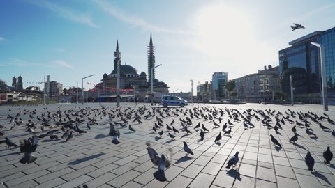 Istanbul Taksim Square and flying doves. Empty Streets without people. Quarantine days. 4K Footage in Turkey