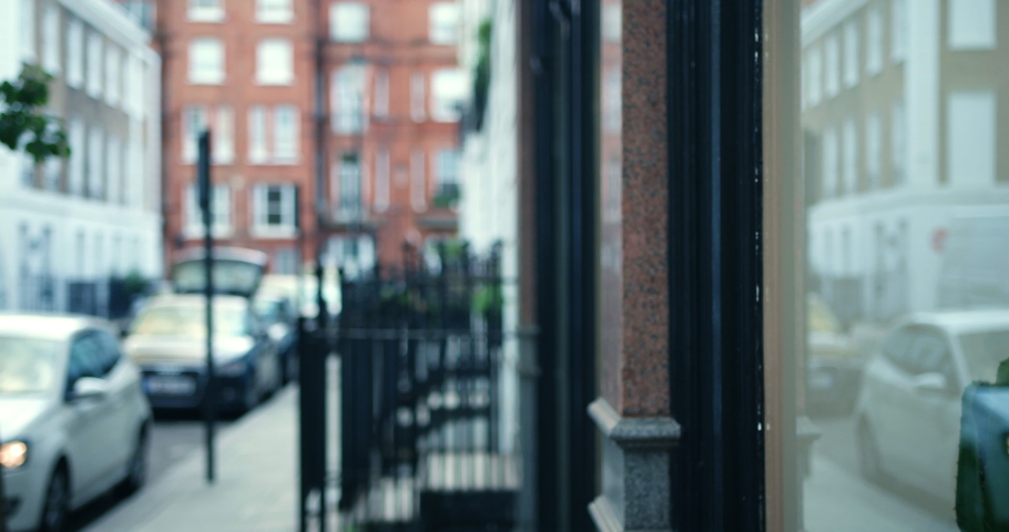 Mixed race homosexual couple window shopping in London, England.