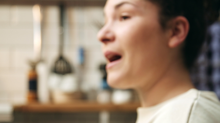 MS SELECTIVE FOCUS Woman talking while working in cafe, Hull, United Kingdom