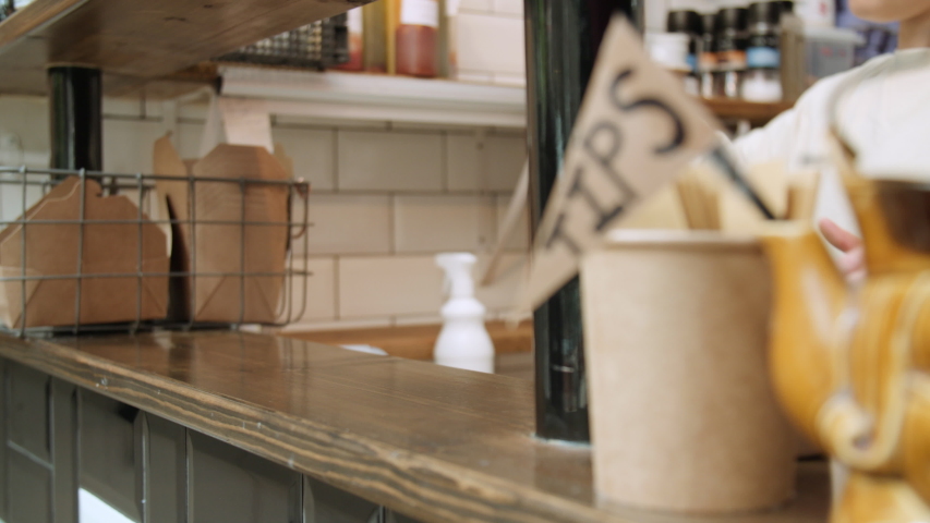 MS Woman preparing cafe counter/ Hull, United Kingdom