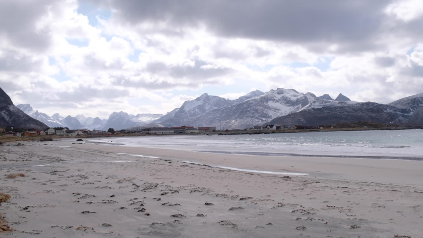 Quiet seascape with an empty beach in Lofoten Islands, Norway, slowmo panning