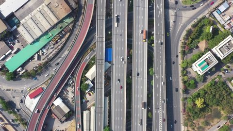 Aerial top View of busy freeway, rush hour heavy traffic jam highway. Aerial view of multiple roads in city, vehicular intersection, expressway with important infrastructure in Bangkok city Thailand.