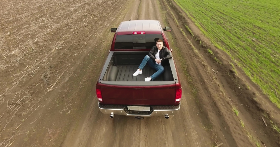 Man rides in pickup truck | Shutterstock HD Video #1054476755