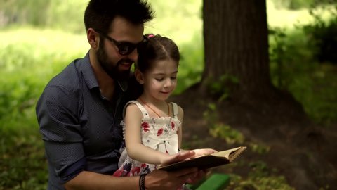 Cheerful Daughter Education Learn 
Read Book On Family Father Day.Single Parent Dad Teach Adorable Cute Preschool Child Girl.Father Reading Little Kid Book.Father's Day Daddy Reading Fairy Tale Story 