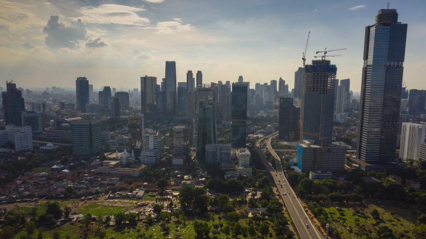 Jakarta city sunny day jakarta city main traffic street skyscraper construction aerial panorama 4k indonesia | Shutterstock HD Video #1054495097