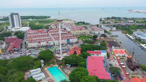 Aerial Orbiting Parallax Taming Sari Tower Malacca Malaysia Bandar Hilir Melaka With Oceans View And Giant Ship Maritime Museum 4K Cinematic Drone Footage