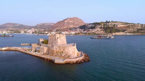 Nafplio Greece sunset drone flyover of fortress in bay