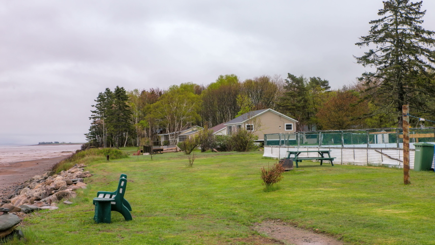 Time-lapse of the retreating tides along the Bay of Fundy ocean shoreline on a misty morning, Nova Scotia, Canada	
