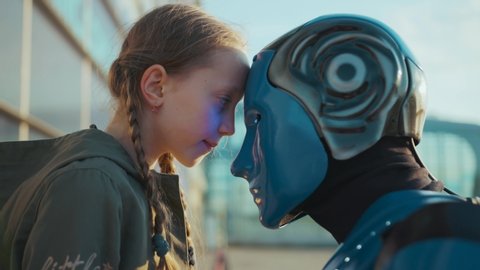 Close up child girl greets her robot friend touching each other foreheads future machine intelligence artificial humanoid science robotics digital virtual fiction communication slow motion