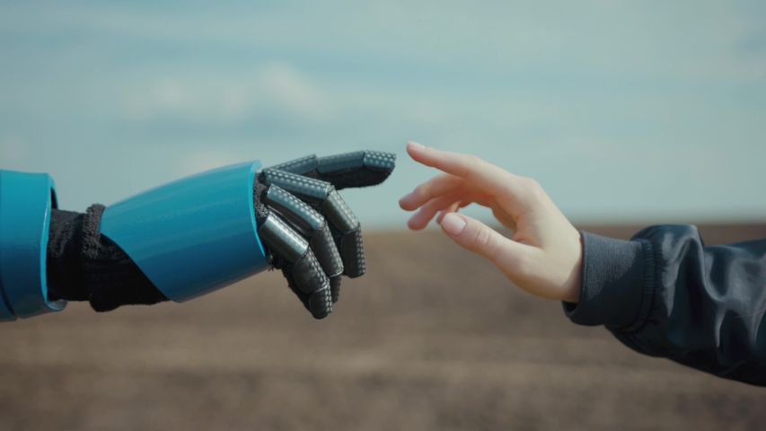 Woman pulling hand to robot repeating her motions outside. Close-up cyborg and human reaching out hands welcoming each other. Artificial intelligence. Future technology. Royalty-Free Stock Footage #1054511606