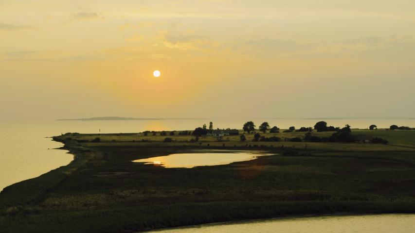Sun setting above danish island